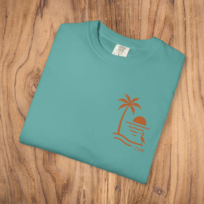 Unisex Sunset Palm Tree T-Shirt - Front view of a stylish turquoise tee featuring a palm tree sunset design, perfect for all genders.
