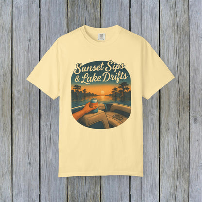 Lake Drifts T-Shirt in soft yellow showcasing a vibrant sunset design with a drink, ideal for summer events and relaxation.