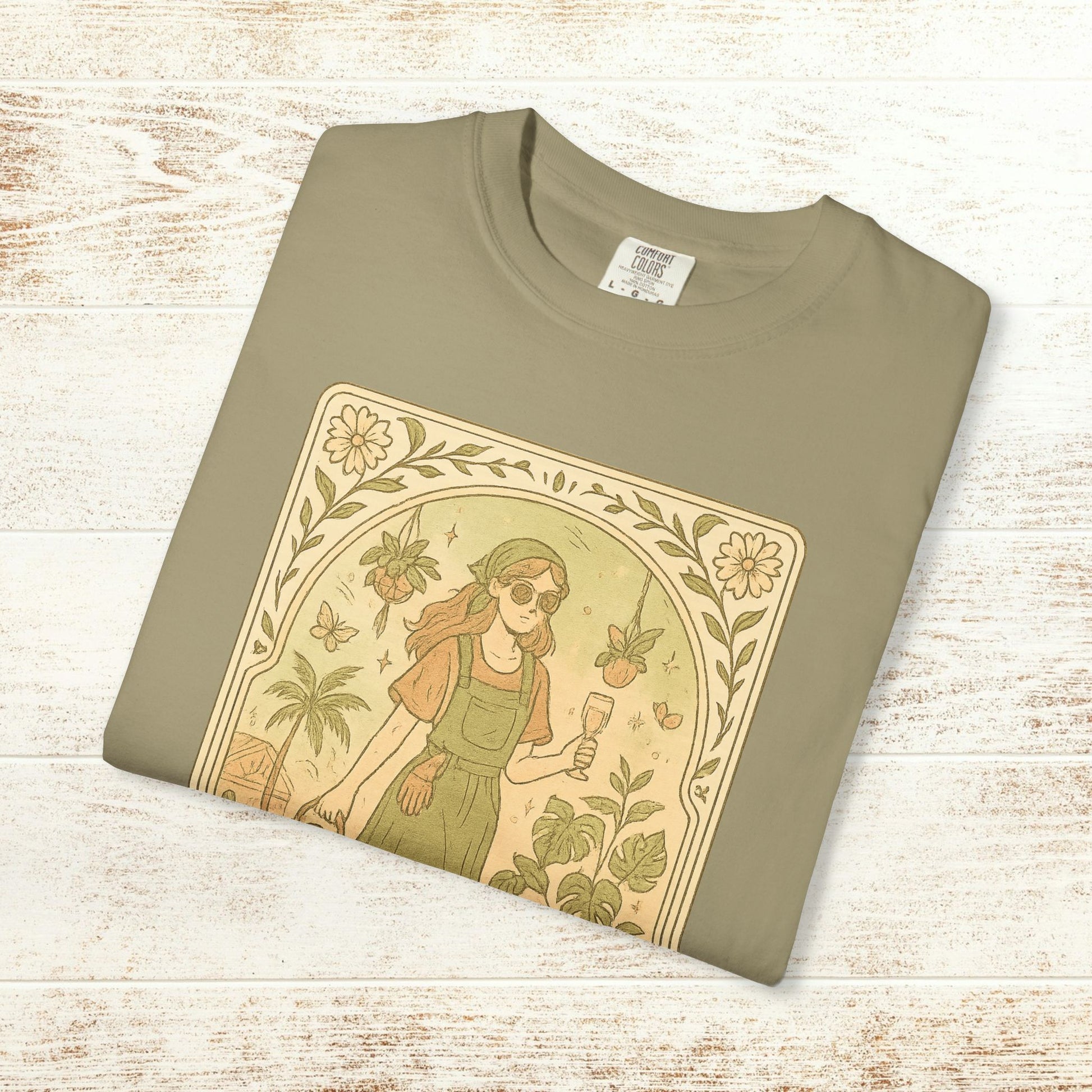 Flat-lay view of the Rooted One Tarot Tee in peaceful olive green, displaying a detailed illustration of a nature-loving woman. Ethically sourced cotton, available in sizes S to 4XL.