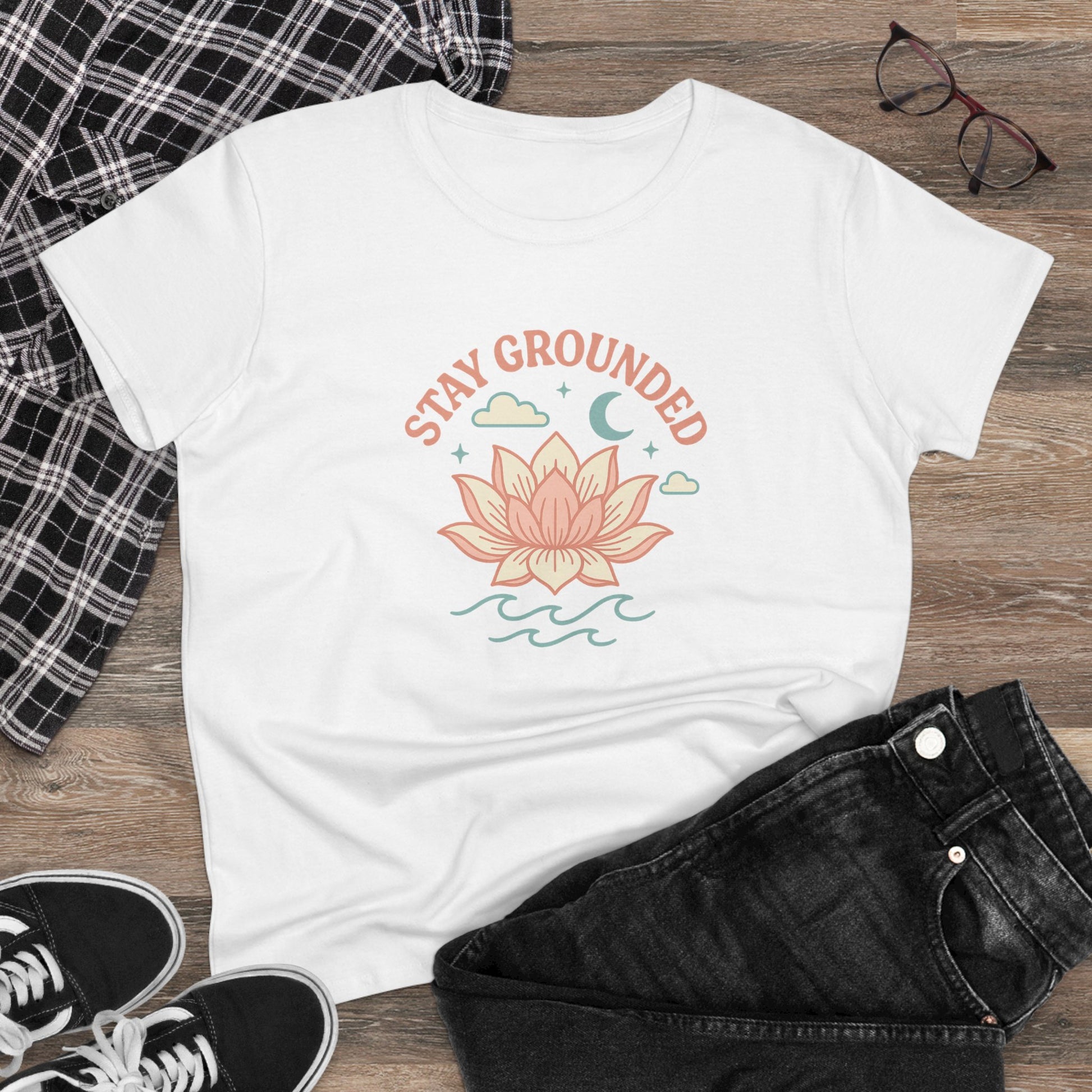 Stay Grounded Spiritual Tee with a vibrant lotus graphic on a cozy white crop top, styled with dark jeans and a plaid shirt, perfect for casual wear.