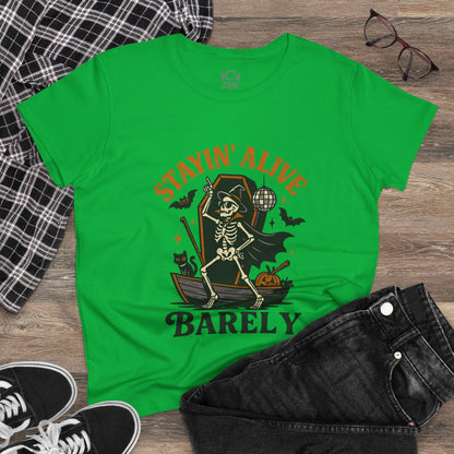 Stayin’ Alive T-Shirt in a vibrant green, showcasing a whimsical skeleton with accessories. Ideal for Halloween parties or casual outings.