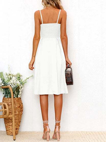 Back view of the Cutout Smocked Sweetheart Neck Cami Dress with Decorative Button and Opaque Design in white, highlighting the smocked back detail.