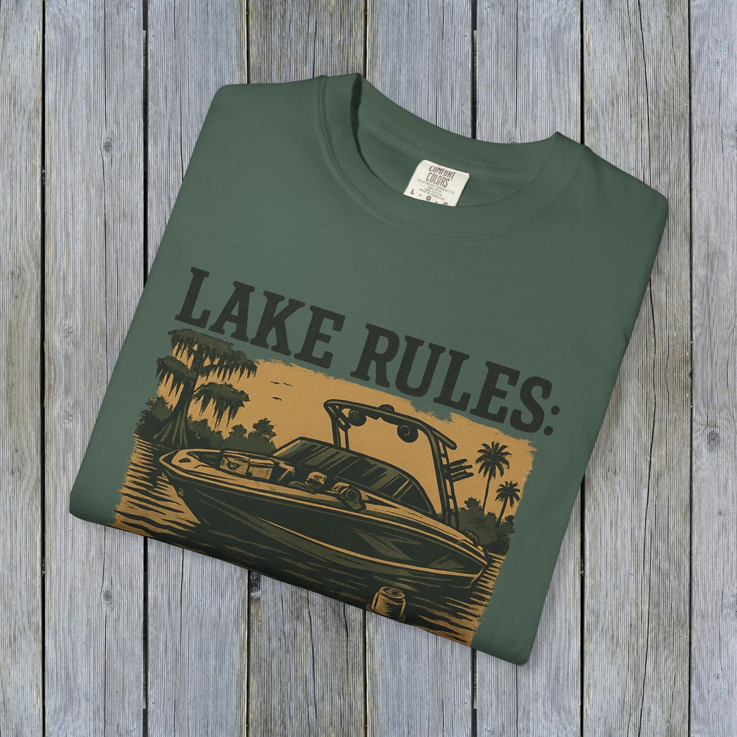 Unisex Garment-Dyed Lake Rules Tee showcasing a green shirt with a boat illustration, perfect for outdoor enthusiasts and lake lovers.