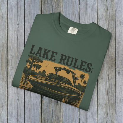 Unisex Garment-Dyed Lake Rules Tee showcasing a green shirt with a boat illustration, perfect for outdoor enthusiasts and lake lovers.