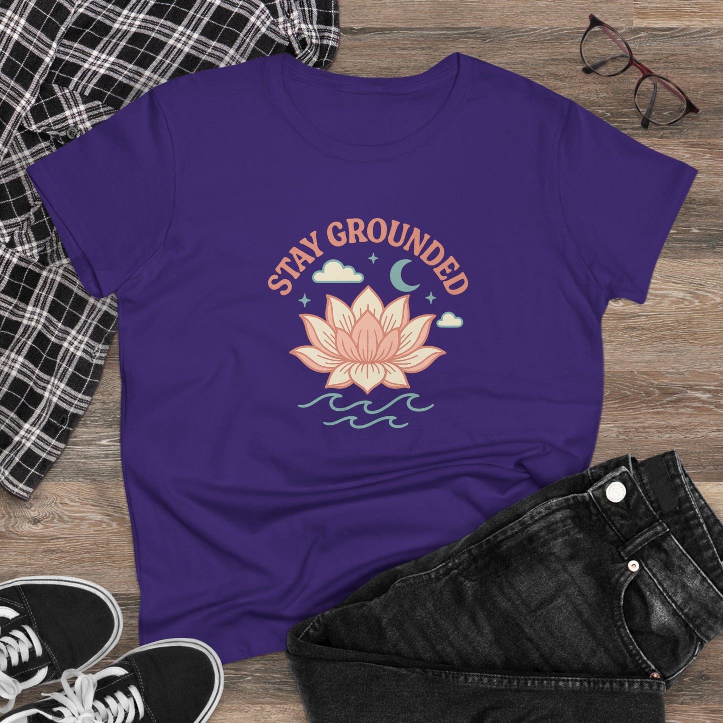 Casual styling of the Stay Grounded Spiritual Tee, showcasing the lotus design with jeans and sneakers, perfect for festival-goers.