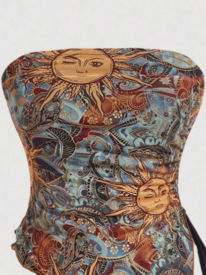 Detailed view of the Trendsi Asymmetrical Drawstring Printed Tube Top highlighting the unique sun design, ideal for contemporary women's fashion. Ruched for a stylish appearance.