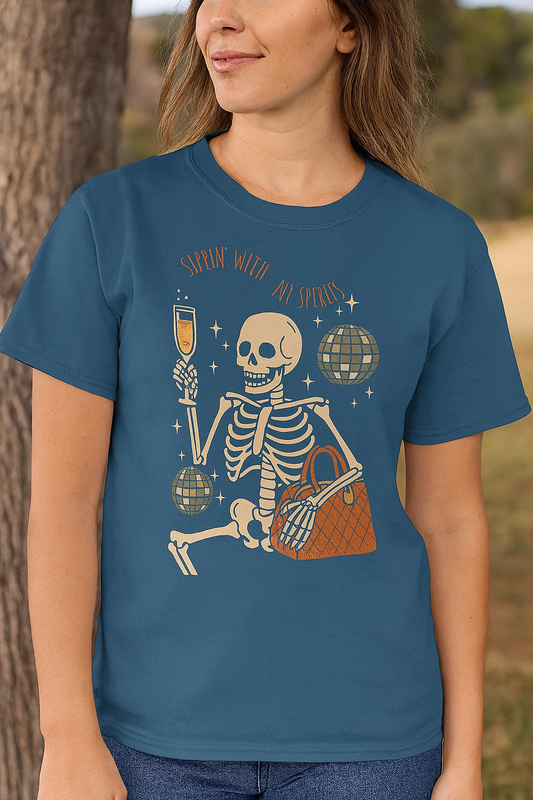 Model wearing Spooky Spirits Graphic Tee featuring a playful skeleton design, perfect for Halloween. The tee is made of 100% cotton and Oeko-Tex certified, highlighting its softness and quality.