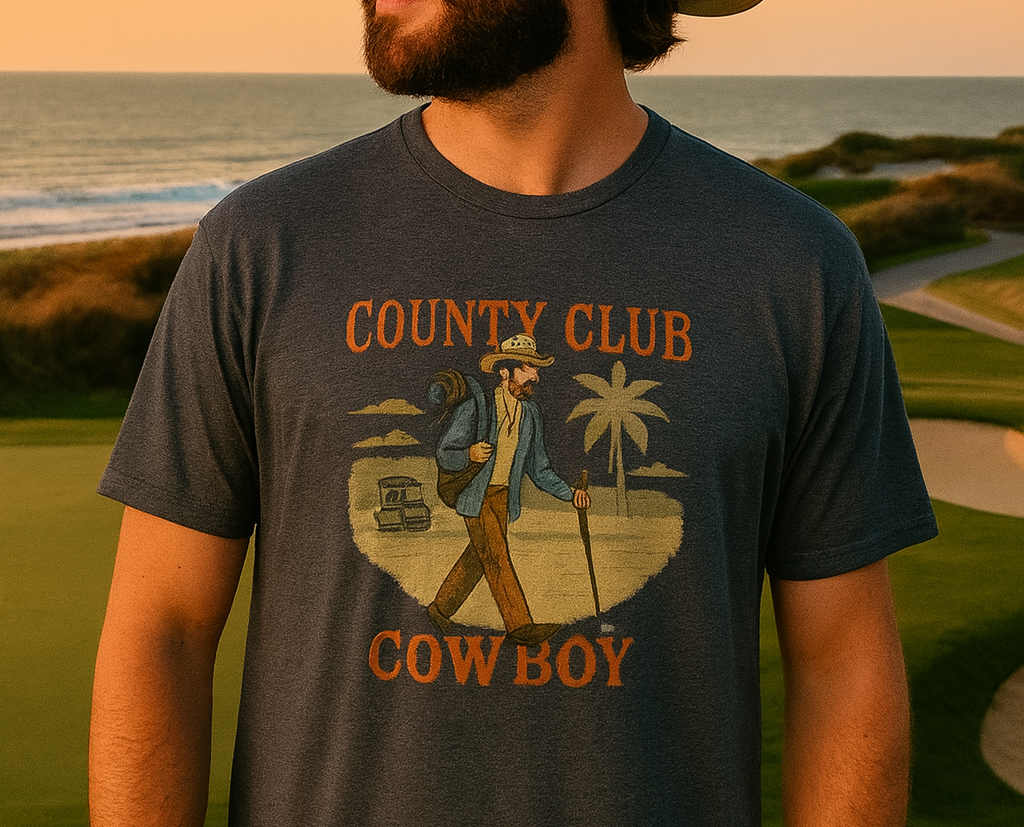 Model wearing the Country Club Cowboy Graphic Tee outdoors, displaying its stylish cowboy graphic against a scenic backdrop.