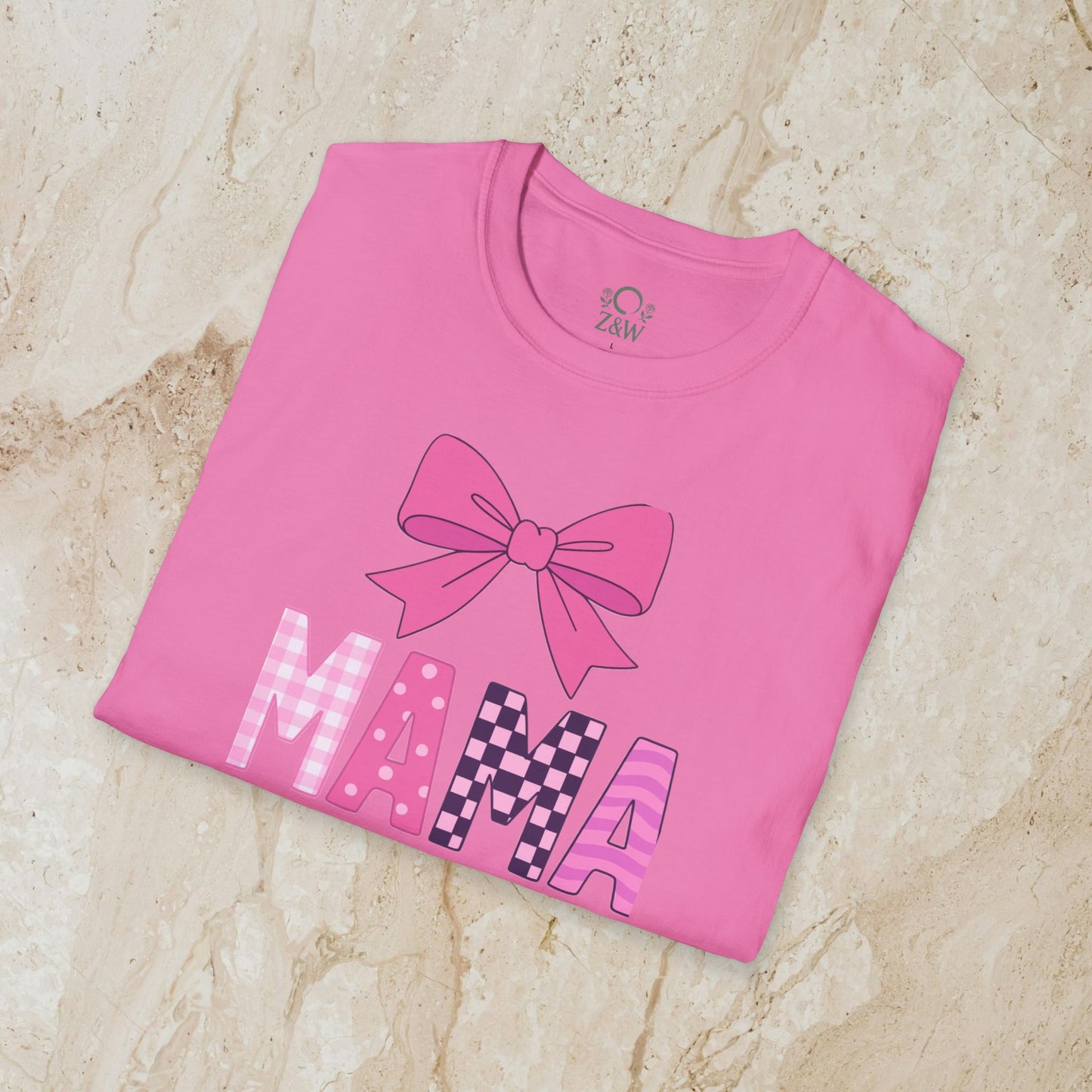 Mama Bow Tee in bright pink color, featuring a large colorful bow graphic and bold letters spelling 'MAMA', crafted from seamless 100% cotton.