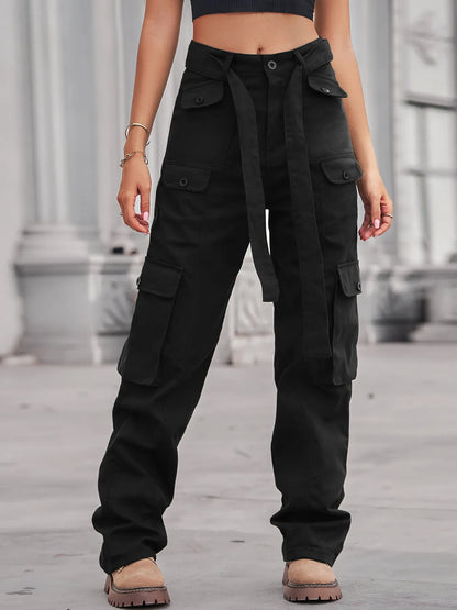 Close-up view of a model in black High-Waisted Multi-Pocket Cargo Jeans, featuring multiple pockets and a tied belt, exuding a trendy look.
