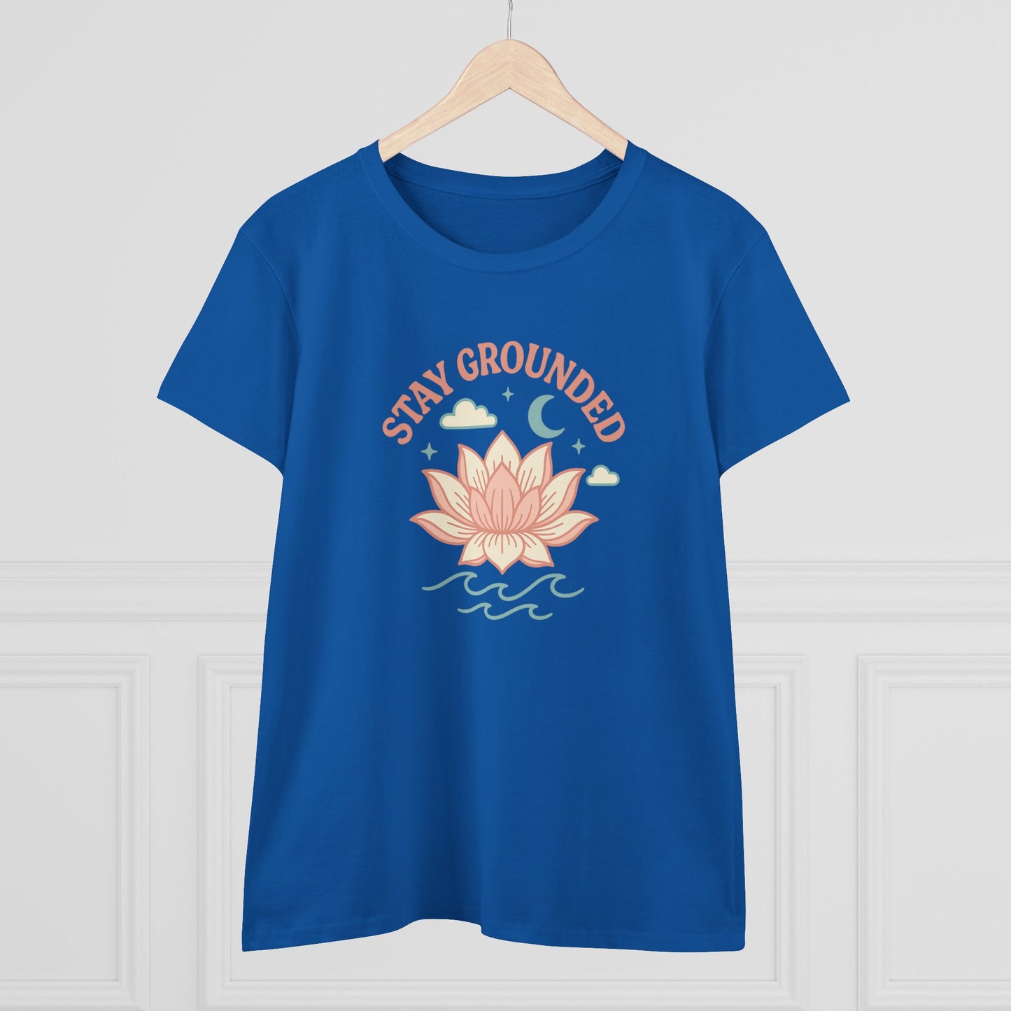 Stay Grounded Spiritual Tee - Blue crop top displayed on a hanger showcasing its stylish lotus flower print, suitable for free spirits.