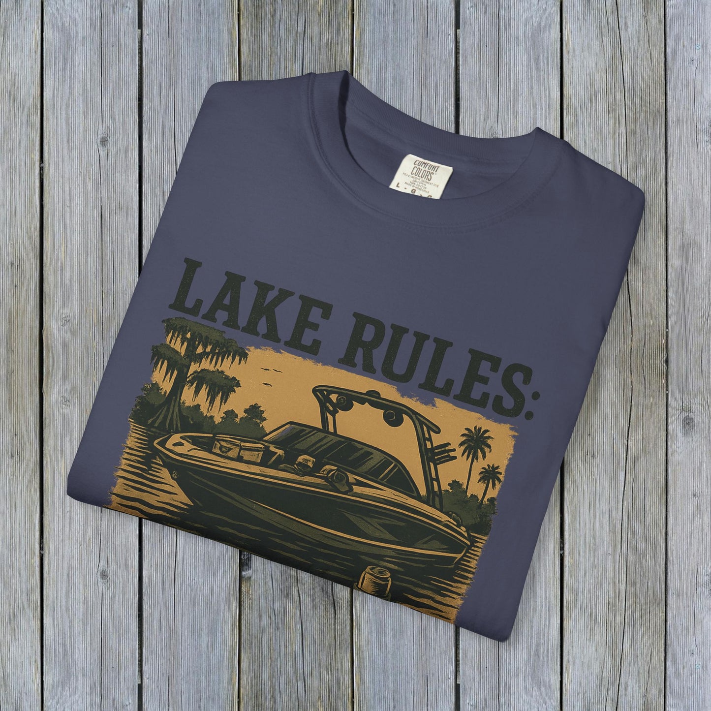 Unisex Garment-Dyed Lake Rules Tee showcasing a stylish design with a boat illustration, perfect for outdoor adventures. Ideal for casual wear.