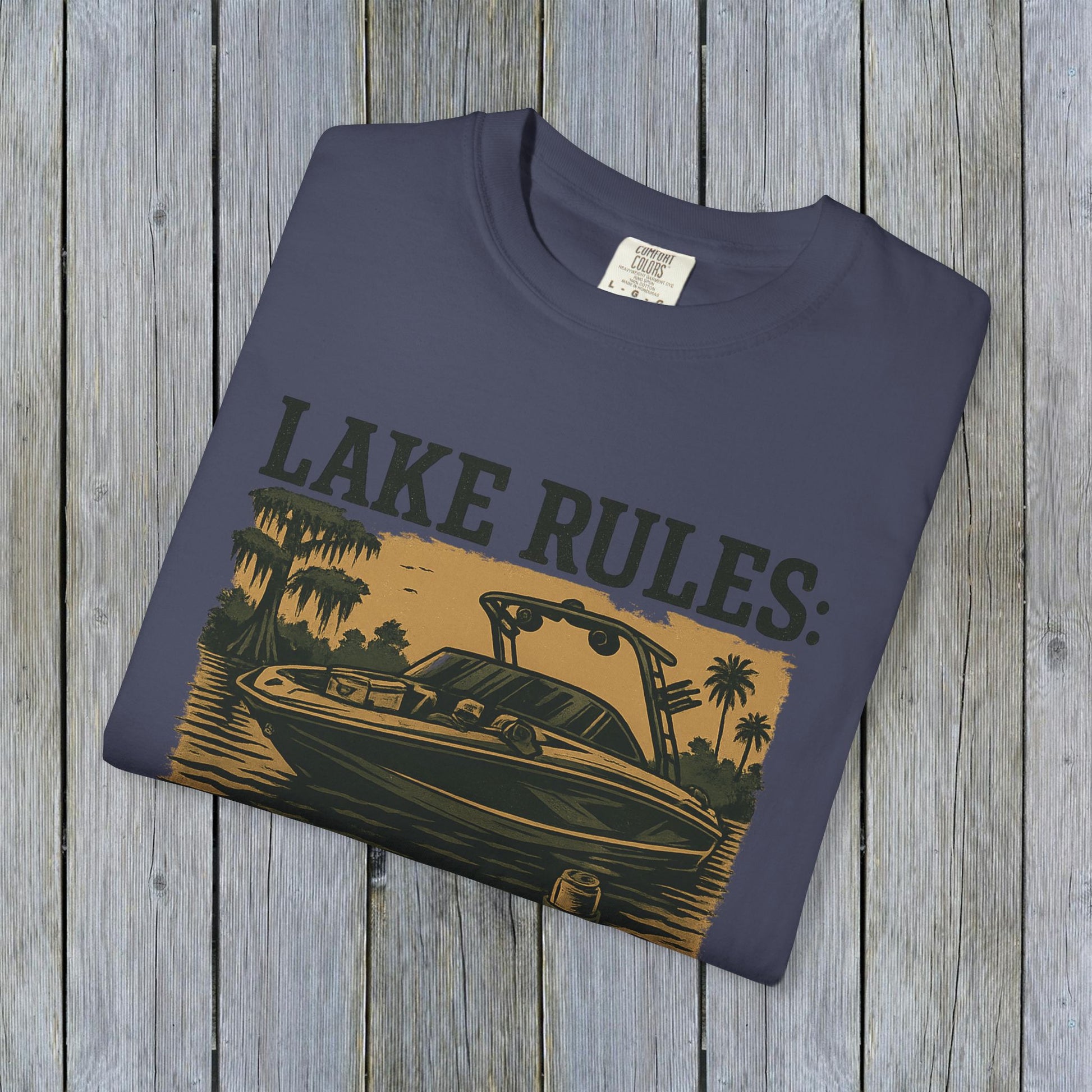 Unisex Garment-Dyed Lake Rules Tee showcasing a stylish design with a boat illustration, perfect for outdoor adventures. Ideal for casual wear.
