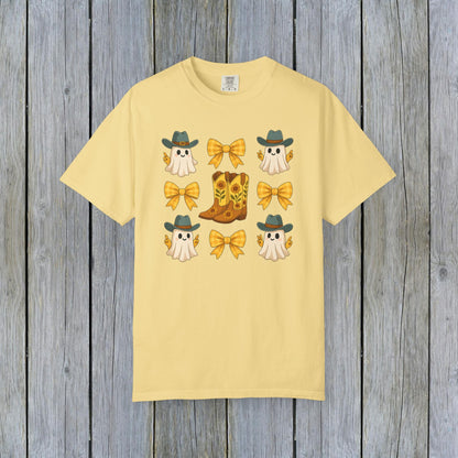 Cute Halloween T-Shirt adorned with whimsical ghosts and cowboy boots, perfect for unisex fall fashion. Made from eco-friendly fabric, ideal for celebrating Halloween.