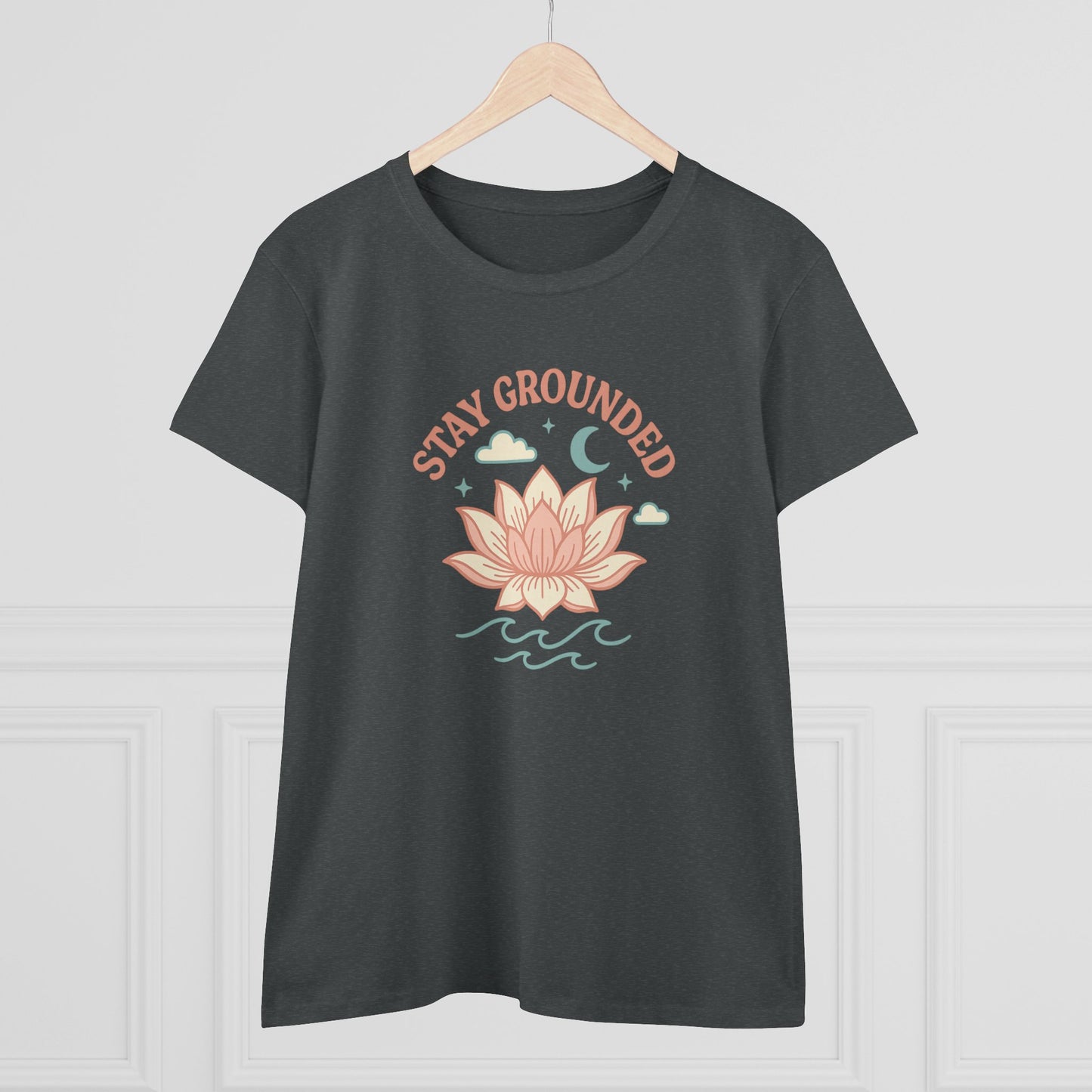 Front view of Stay Grounded Spiritual Tee featuring a lotus design, ideal for warm weather festivals and casual days, showcased in a modern setting.