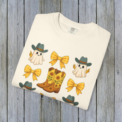 Cute Halloween T-Shirt featuring playful ghosts and cowboy boots design, perfect for unisex fall fashion, made with eco-friendly fabric.