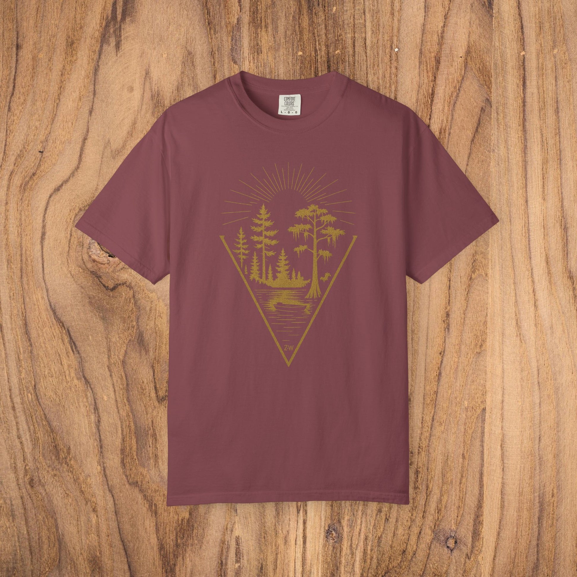 Nature Outdoor Vibes Tee in maroon, made from 100% US cotton, features a vibrant nature-themed graphic design of trees and sun, offering durable construction and seamless comfort, available in sizes S-4XL.