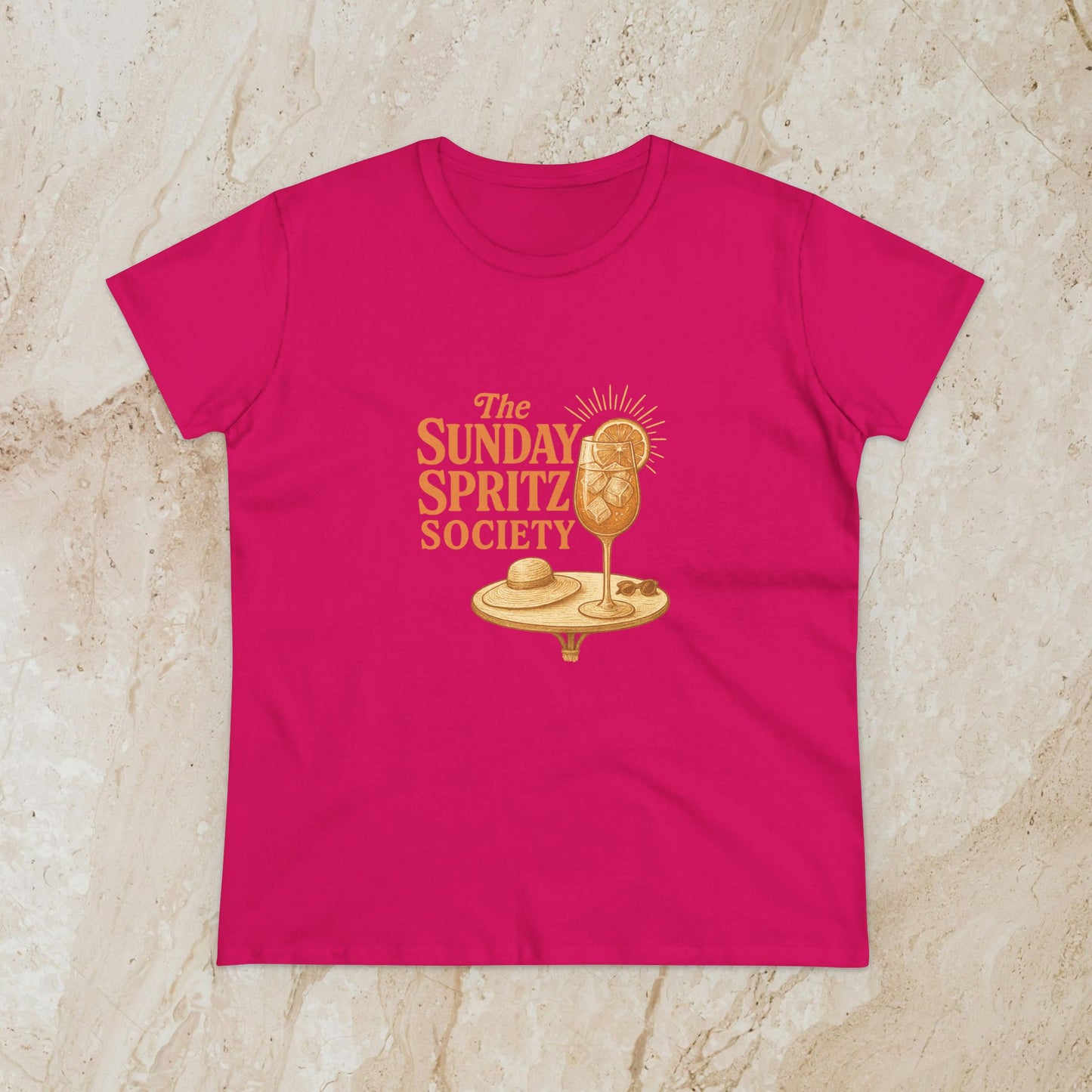 Vibrant pink Women's Midweight Cotton Tee with 'The Sunday Spritz Society' graphic, perfect for adding a pop of color to your casual wardrobe.
