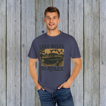 Model wearing the Unisex Garment-Dyed Lake Rules Tee, featuring a vintage boat design, representing a laid-back outdoor lifestyle. Available in sizes S to 4XL.