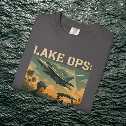 Folded Garment-Dyed Comfort Tee For Adults in dark gray displaying 'Lake Ops: Whiskey on Deck' design, offering comfort and style.