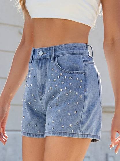 Model wearing Rhinestone Washed High Waist Denim Shorts, emphasizing the fashionable high waist and unique rhinestone design.