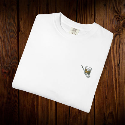 Men's Golf & Whiskey Tee featuring an eye-catching whiskey glass design on a soft cotton fabric, perfect for golf enthusiasts.