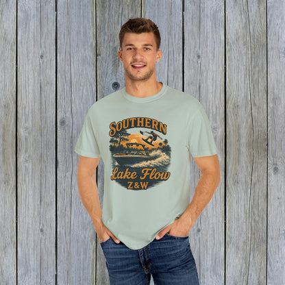 Southern Lake Flow T-Shirt worn by a man, in a soft pastel green shade, emphasizing its eco-friendly 100% US cotton fabric and stylish graphic.