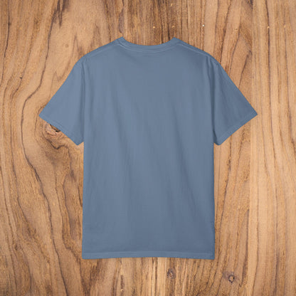 Bayshore Lifestyle Tee - 100% Cotton Lightweight Fabric, Ribbed Neck, Sizes XS-5XL - Back view of a blue t-shirt displayed on wood background.