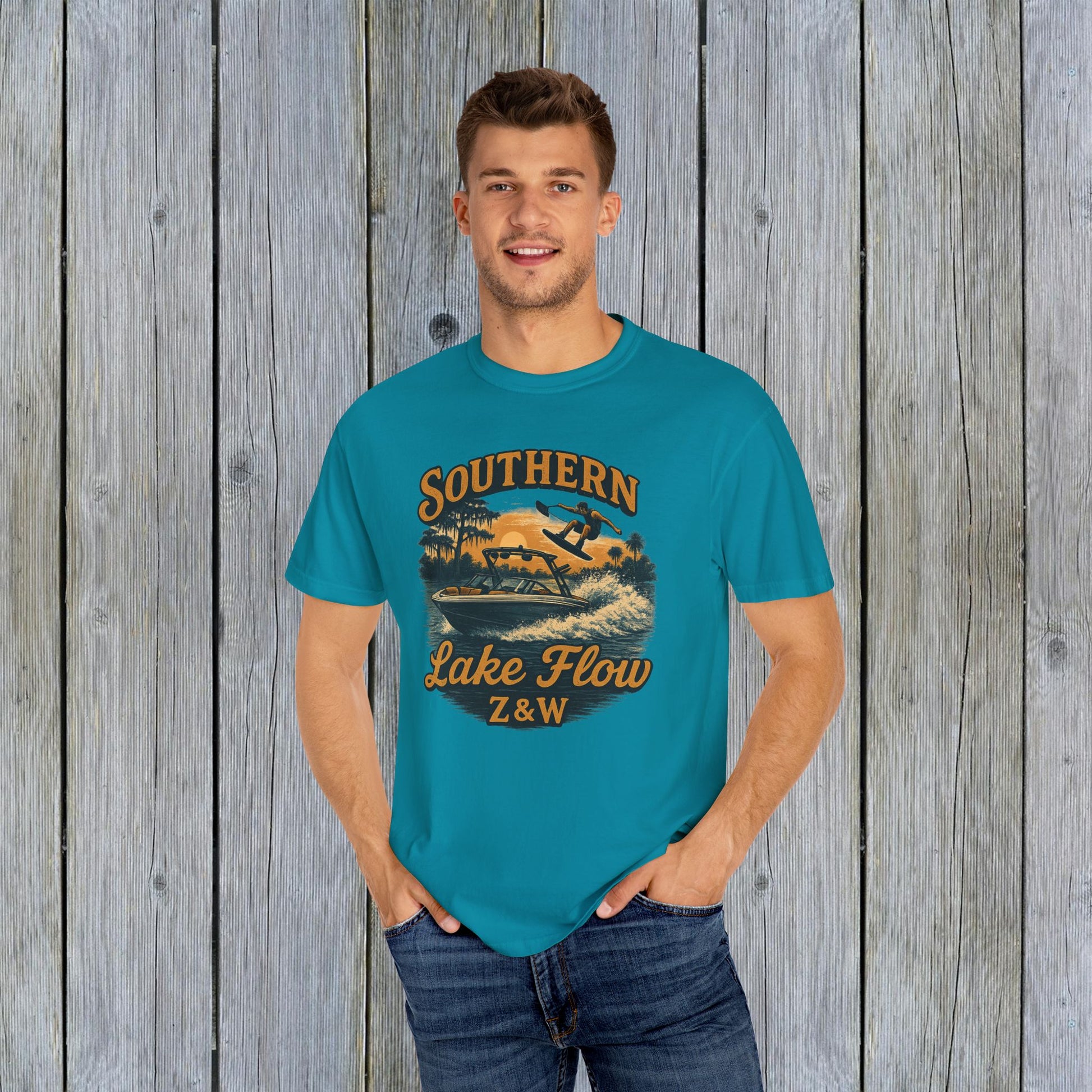 Southern Lake Flow T-Shirt worn by a man in bright blue, made from 100% US cotton, showcasing a stylish and eco-friendly casual design.