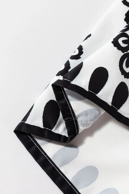 Detailed view of the hem of the Tied Printed Shorts, showcasing the intricate black and white print, perfect for stylish summer outfits.