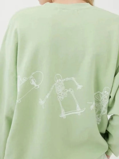 Oversized Skeleton Graphic Sweatshirt for Women featuring a playful skeleton design on the back, perfect for adding a trendy flair to your casual outfit.