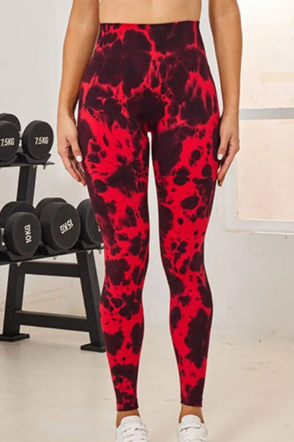 Slightly Stretchy Tie-Dye High Waist Active Leggings in red, displayed from the front in a gym setting.