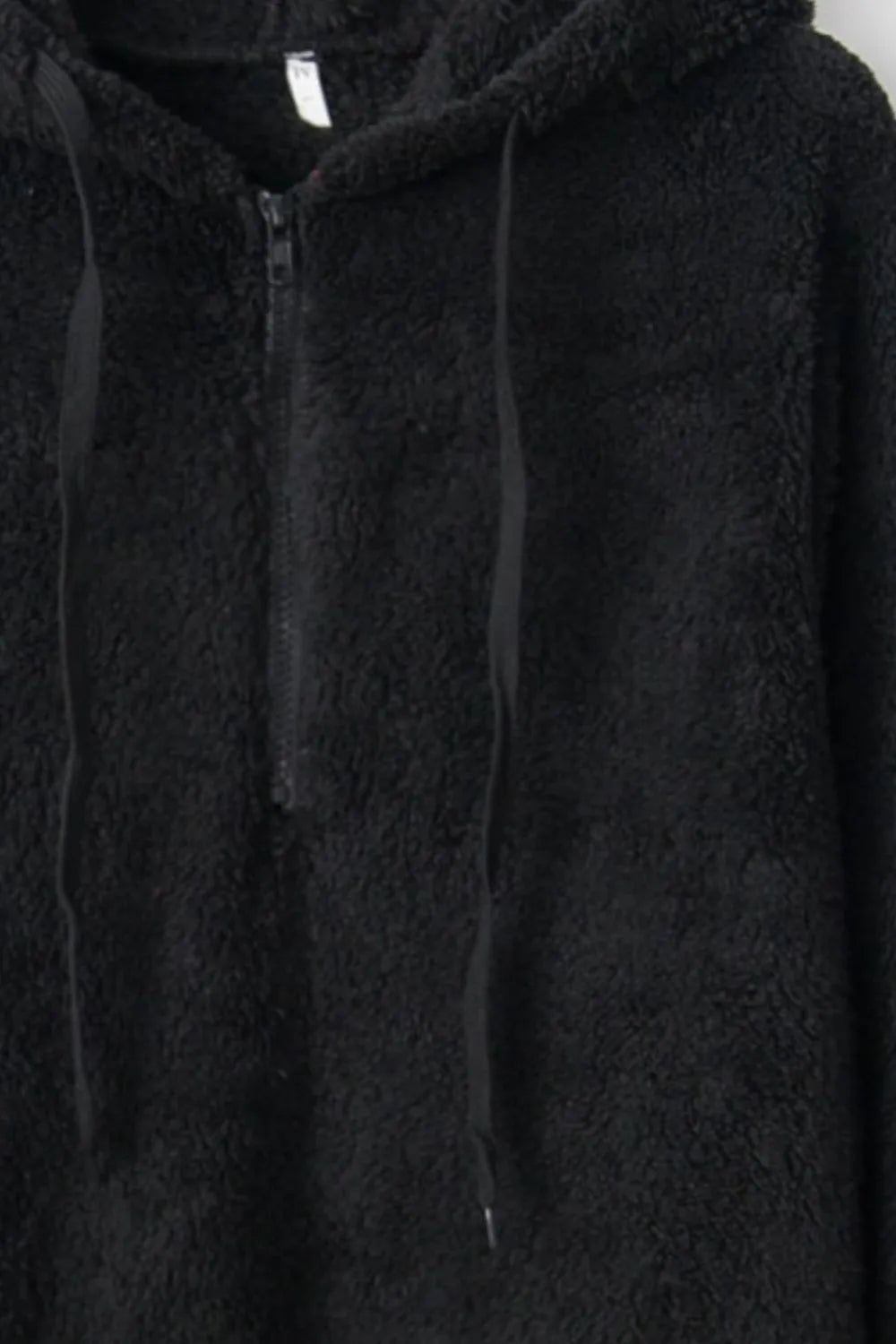 Close-up of the Cozy Full Size Teddy Hoodie with Quarter-Zip and Drawstring in black, emphasizing the high-quality fleece material and functional front zipper.
