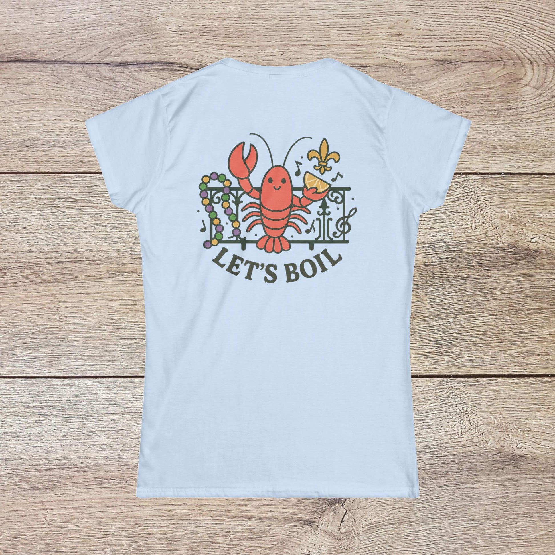 Crawfish Boil Shirt for Women featuring a playful lobster design with the text 'LET'S BOIL' on a light blue background, perfect for summer festivals and NOLA celebrations in a comfortable and stylish fit.