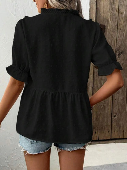 Back view of the black Swiss Dot Ruffled V-Neck Blouse with Flounce Sleeves, displaying its stylish cut and comfortable fit for everyday wear.