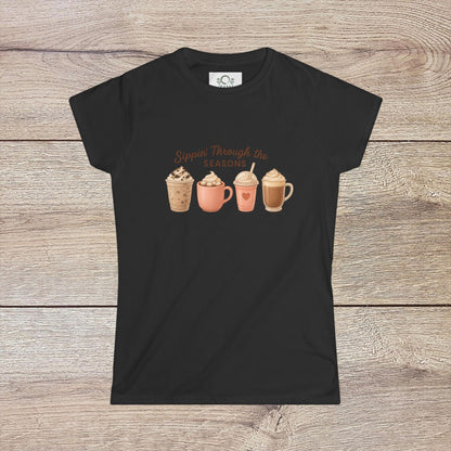 Sippin' Through The Seasons Slim Fit Tee in black, illustrating four delightful coffee beverages. This slim fit shirt is made from 100% combed cotton and features a tear away label for added convenience.