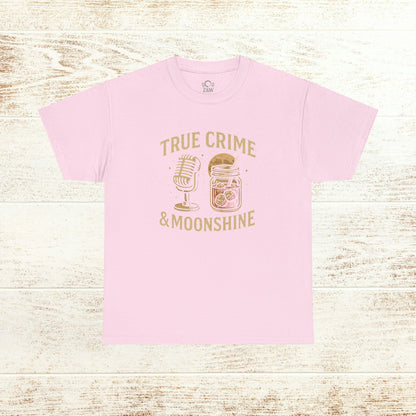 True Crime & Moonshine Unisex Graphic Tee in pink showcasing a playful vintage design with a microphone and jar, perfect for true crime enthusiasts.