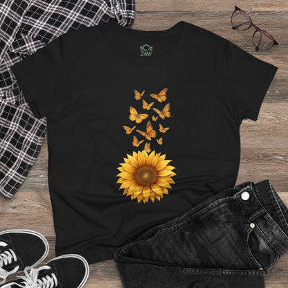 Sunflower & Butterflies Cotton Tee for Women on a wooden surface, with a detailed sunflower and butterfly print, demonstrating its breathable and durable 100% cotton construction.