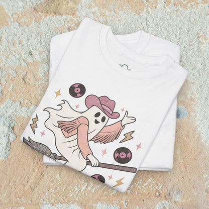 Spooky Cowgirl Graphic Tee showcasing a cute ghost in a cowboy hat on a broomstick, ideal for layering, designed for a fun Halloween look.