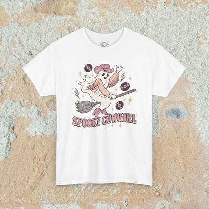 Spooky Cowgirl Graphic Tee featuring a playful ghost with a cowboy hat on a broom, surrounded by vinyl records, perfect for Halloween enthusiasts.