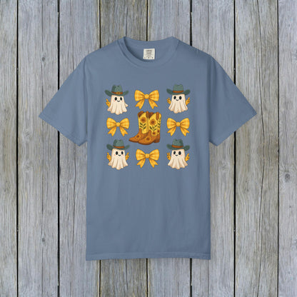 Cute Halloween T-Shirt displayed with cheerful ghosts, cowboy hats, and yellow bows, paired with a stylish cowboy boot, designed with eco-friendly fabric.