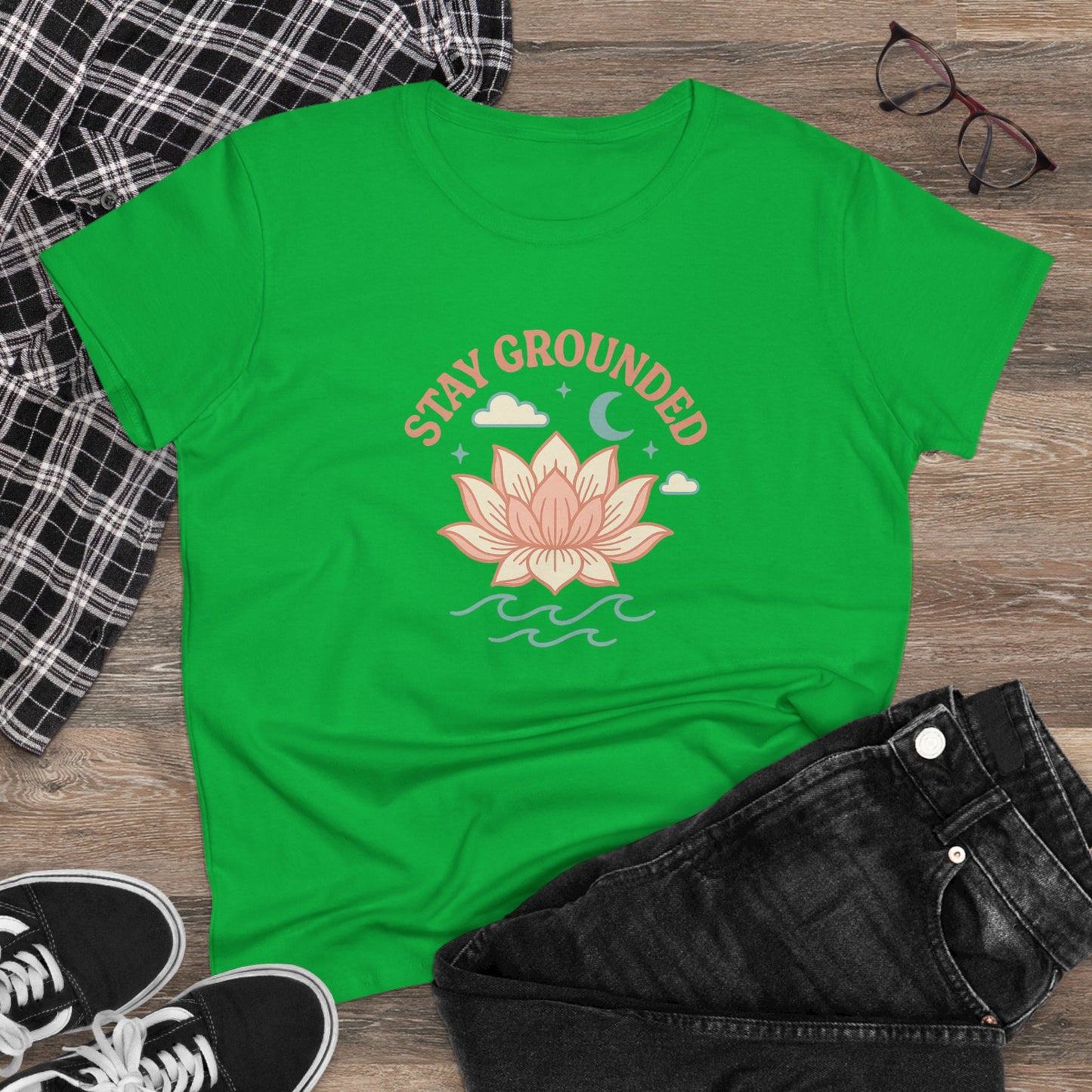 Casual setting with the Stay Grounded Spiritual Tee in green, styled with jeans and accessories, ideal for festivals and laid-back outings.