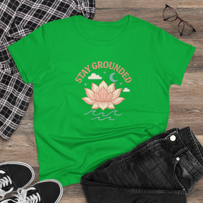 Casual setting with the Stay Grounded Spiritual Tee in green, styled with jeans and accessories, ideal for festivals and laid-back outings.