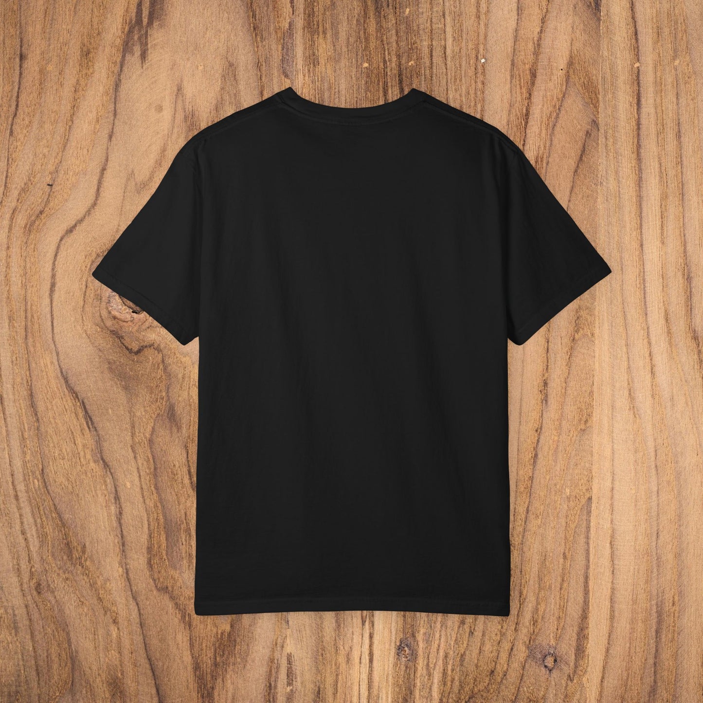 Back view of Country Club Cowboy Graphic Tee in black, featuring a smooth and clean design on natural wooden background.