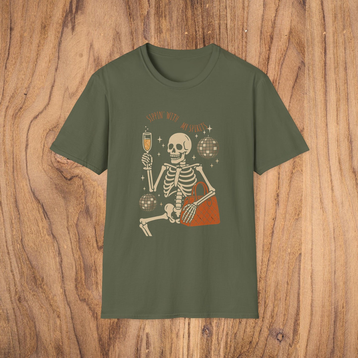 Spooky Spirits Graphic Tee in olive green with a fun skeleton enjoying a drink, ideal for Halloween festivities.