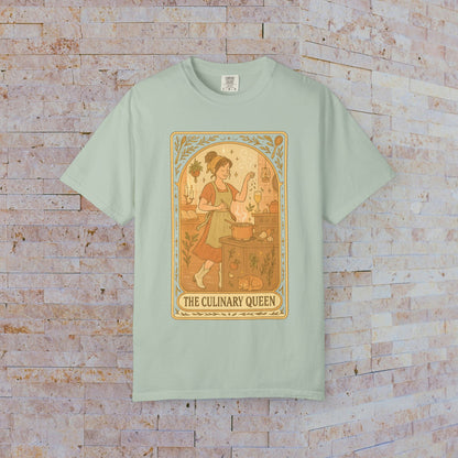 Culinary Queen Tarot Tee in mint green, depicting a delightful artwork of a girl cooking. This soft cotton shirt is available in sizes S to 4XL and comes pre-shrunk.