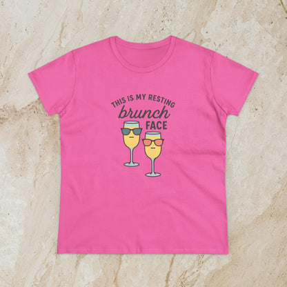 Women's Premium 100% Cotton Brunch Face Tee in pink displaying a lighthearted illustration of two drinks with sunglasses along with the saying 'THIS IS MY RESTING brunch FACE'. Ideal for a casual brunch outing.