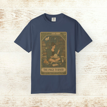Page Turner Tarot Tee - A vibrant navy soft cotton t-shirt with an artistic depiction of a person enjoying a good book, available in sizes S to 4XL.