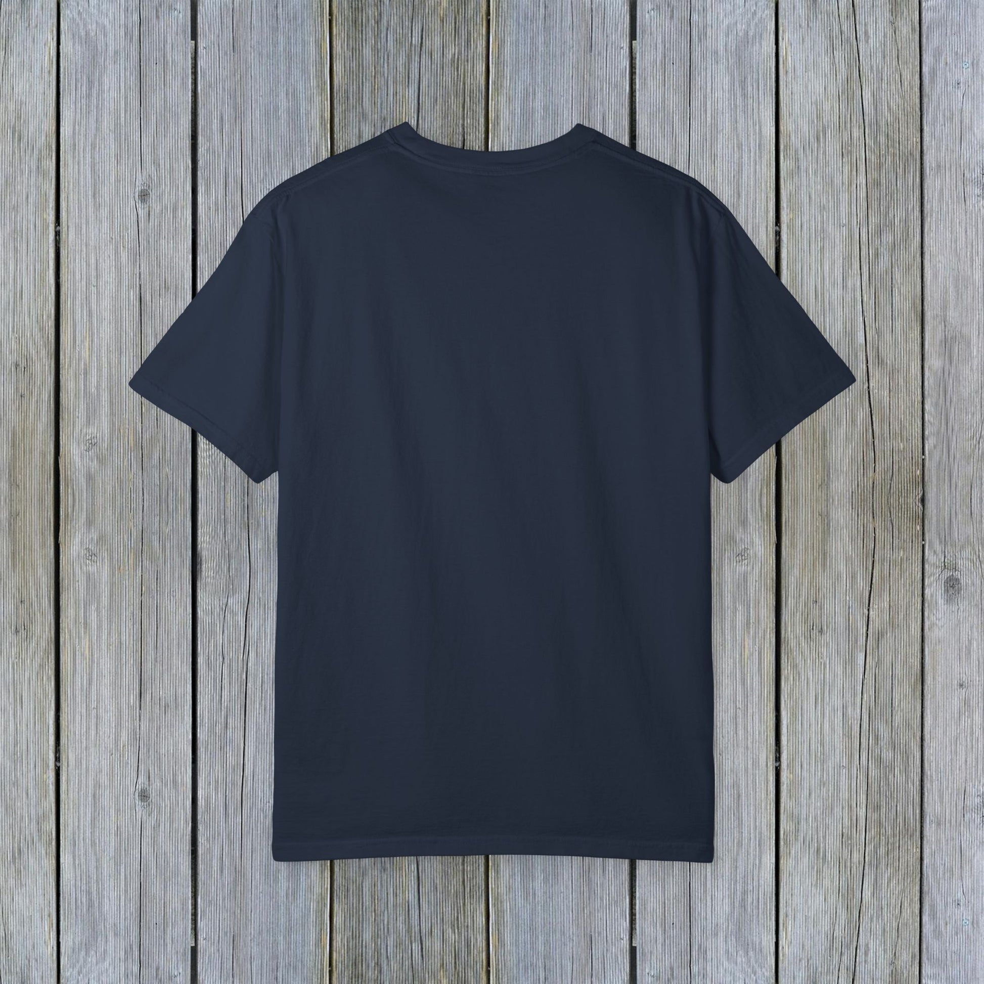 Back view of the Unisex Garment-Dyed Lake Rules Tee showcasing a soft vintage fabric, ideal for casual wear outdoors.