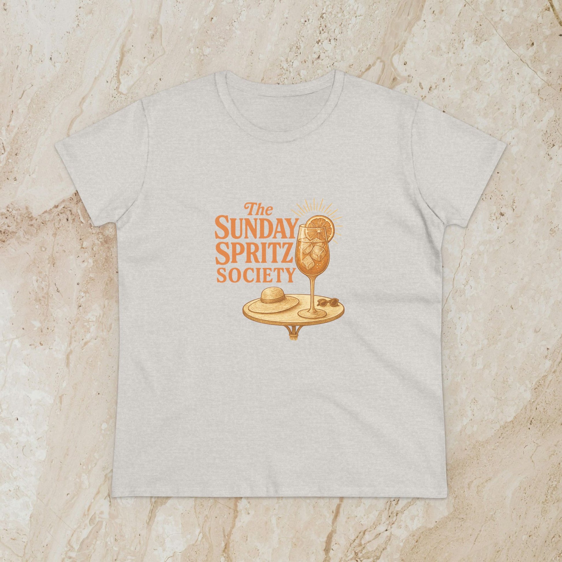 Heather gray Women's Midweight Cotton Tee displaying 'The Sunday Spritz Society' design, combining comfort and style for everyday wear.